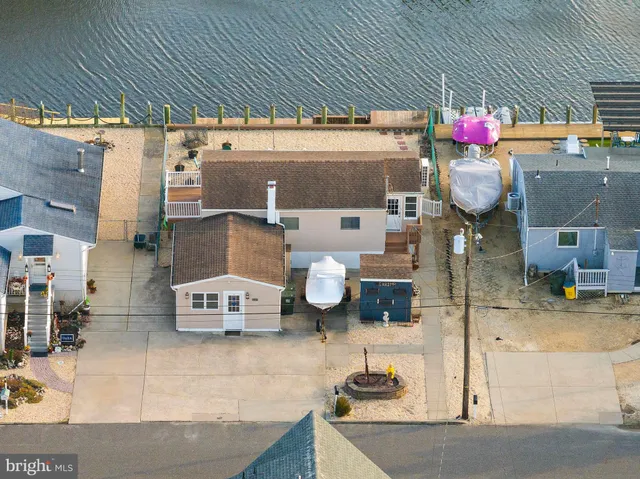 a bathroom with a sink mirror and vanity