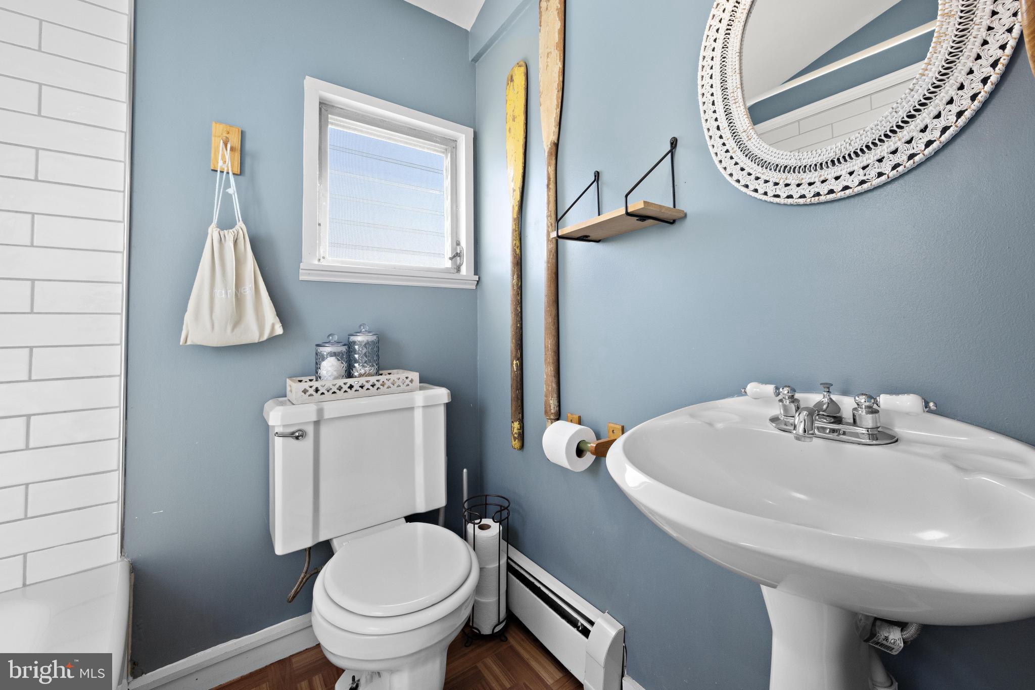 79 Dolphin Road Tuckerton, NJ 08087 - Photo 28 of 53 a bathroom with a sink a toilet and a mirror