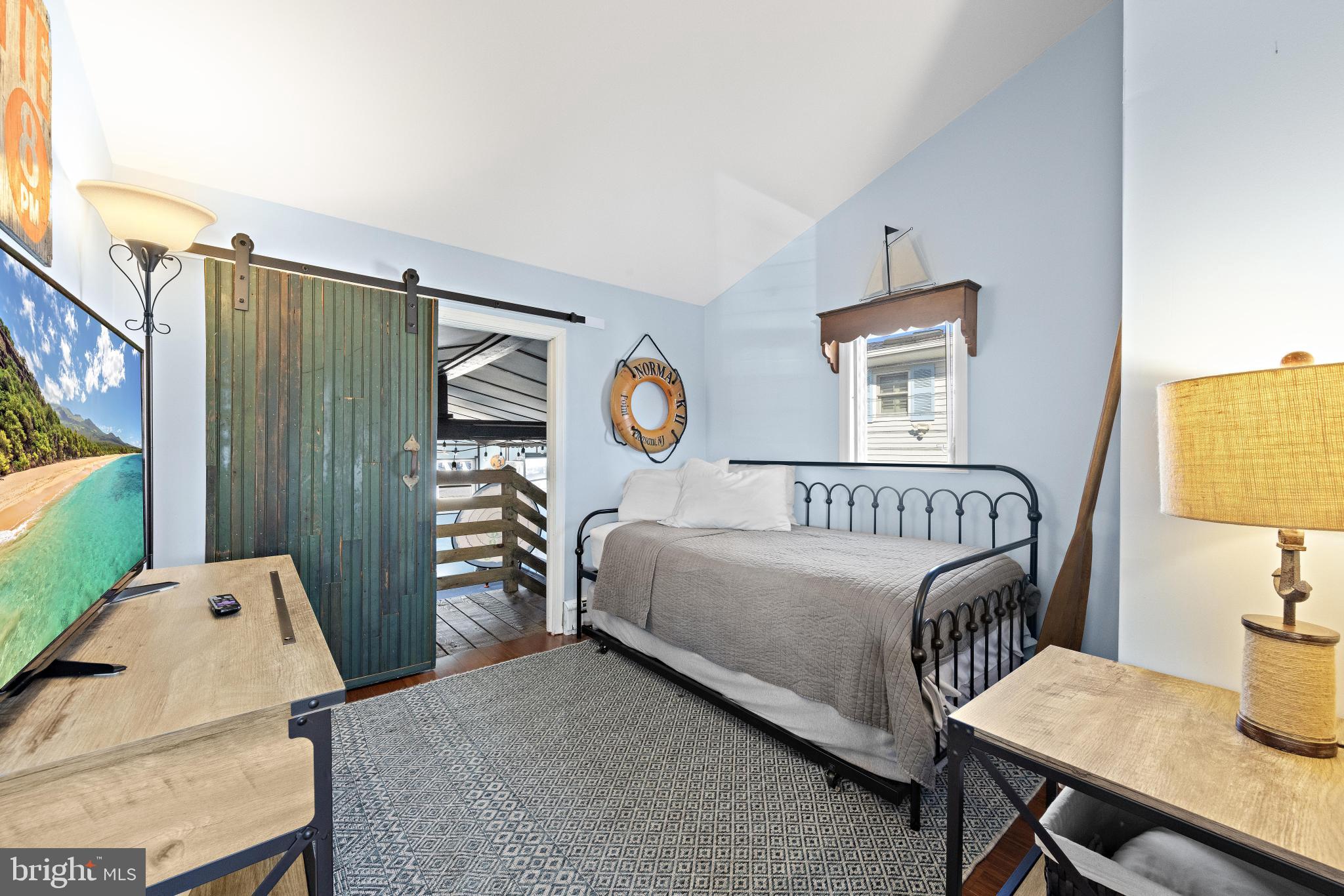 79 Dolphin Road Tuckerton, NJ 08087 - Photo 32 of 53 a bedroom with a bed and a table in it