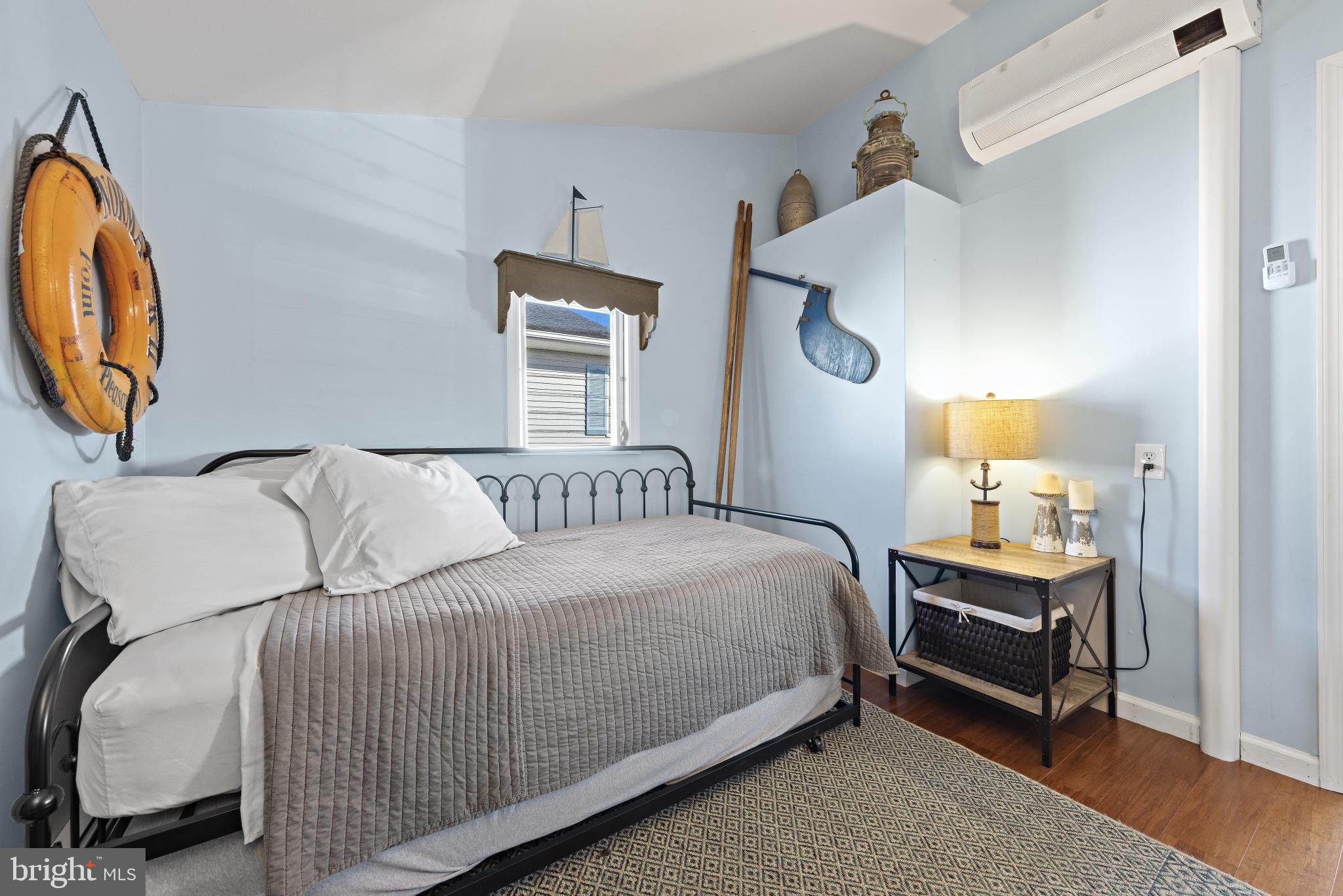 79 Dolphin Road Tuckerton, NJ 08087 - Photo 33 of 53 a bedroom with a bed and a mirror