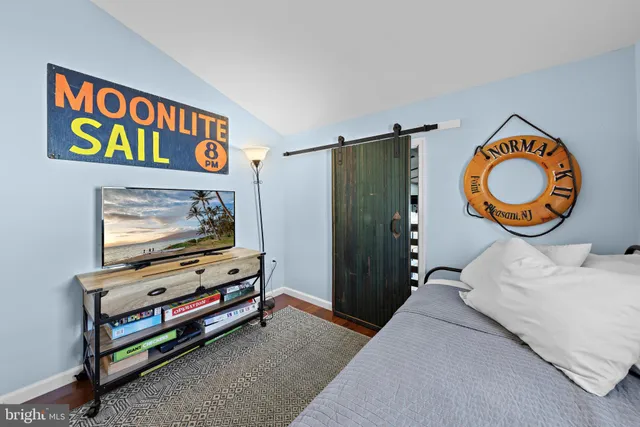 a bedroom with a bed and a table