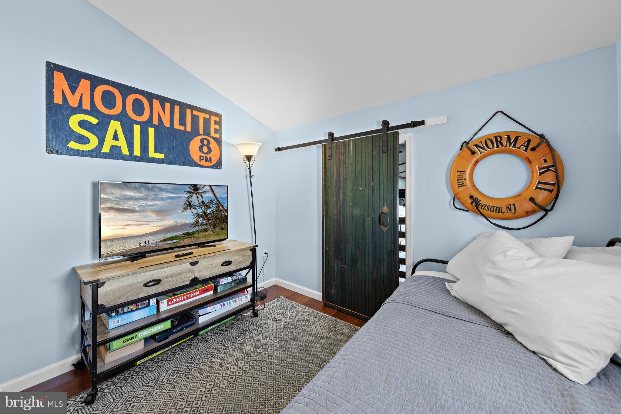 79 Dolphin Road Tuckerton, NJ 08087 - Photo 34 of 53 a bedroom with a bed and a flat screen tv