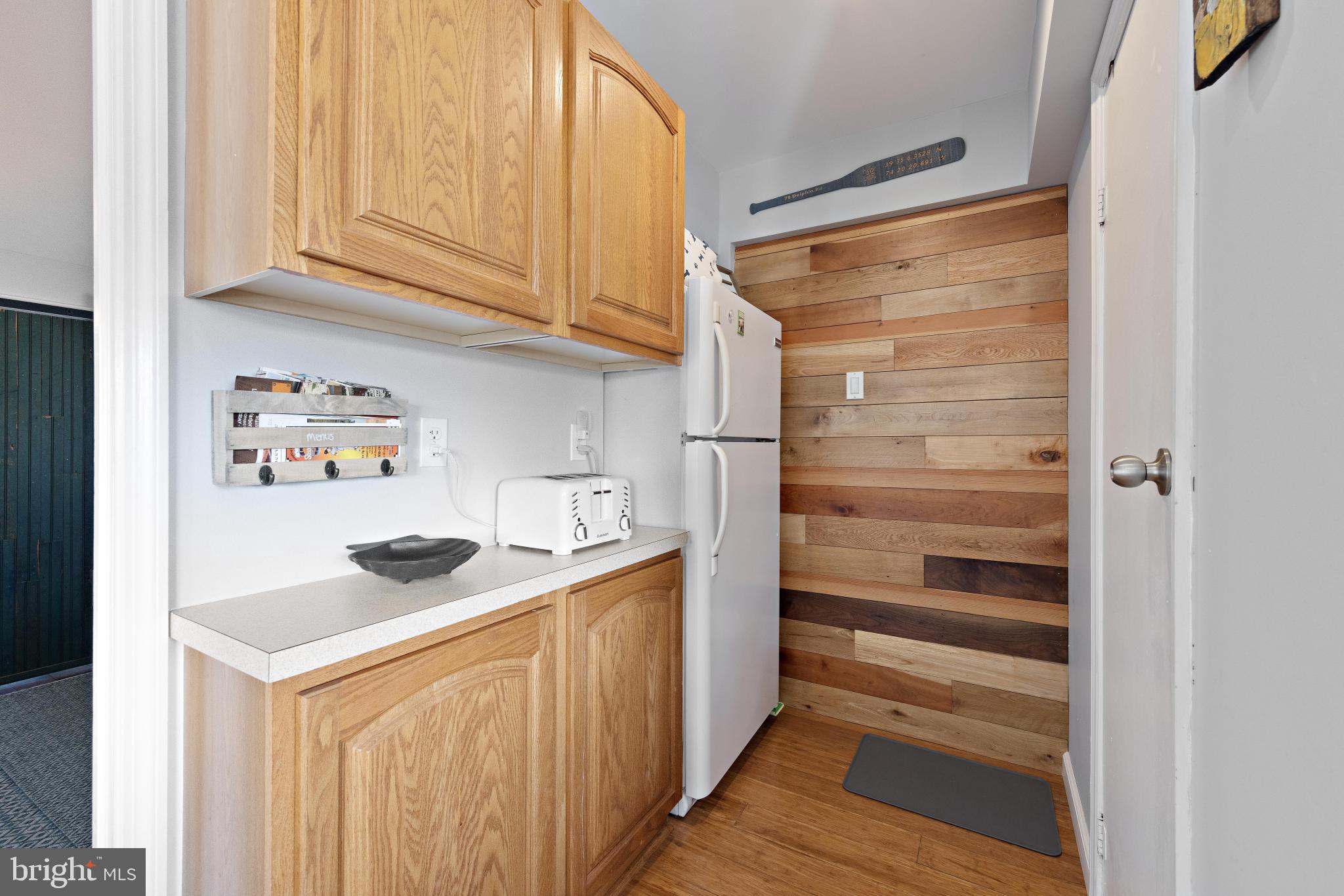 79 Dolphin Road Tuckerton, NJ 08087 - Photo 36 of 53 a kitchen with a refrigerator and a stove
