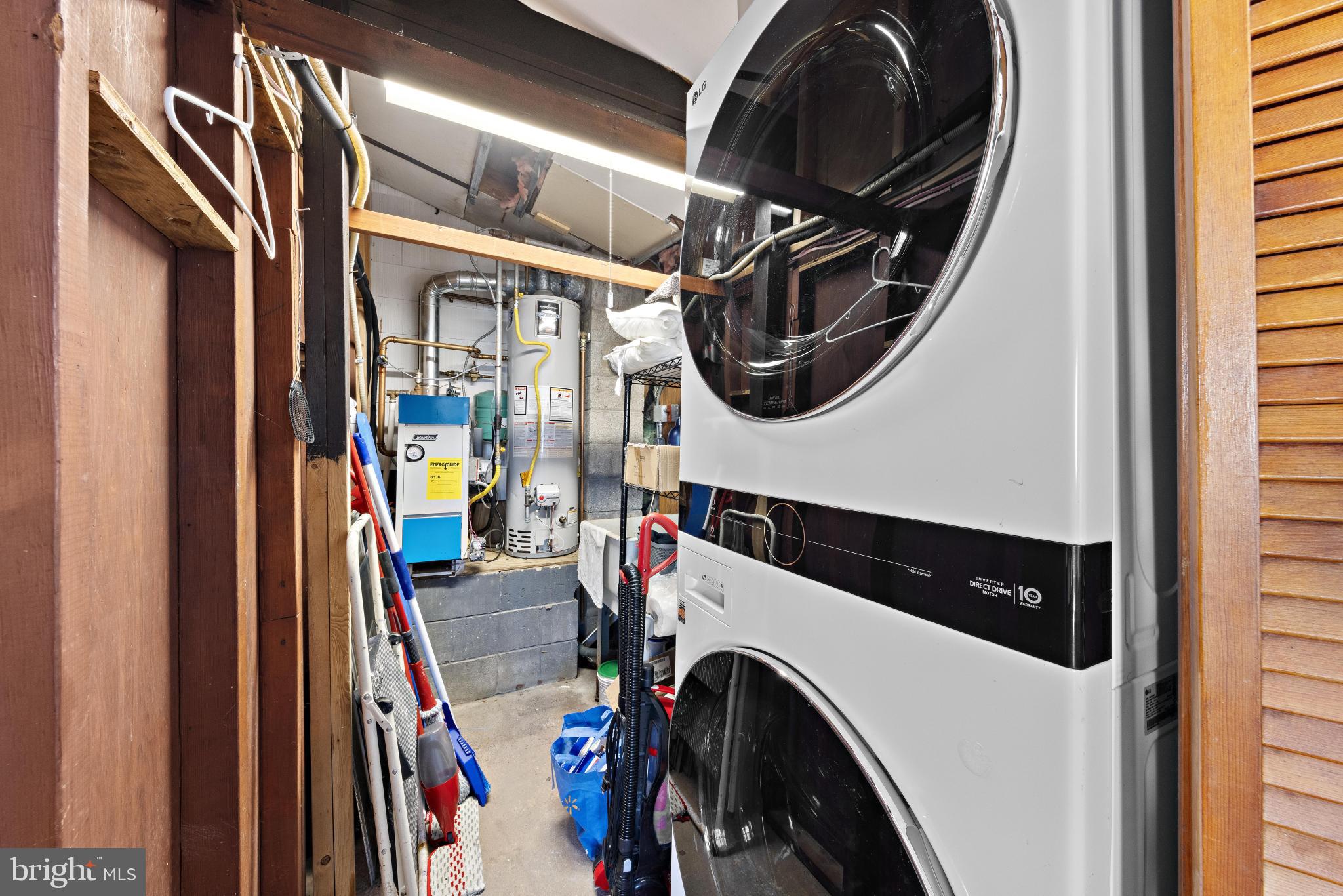 79 Dolphin Road Tuckerton, NJ 08087 - Photo 43 of 53 a utility room with dryer washer and a view of living room