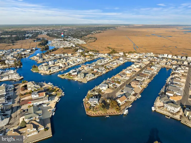 an aerial view of residential building with ocean view
