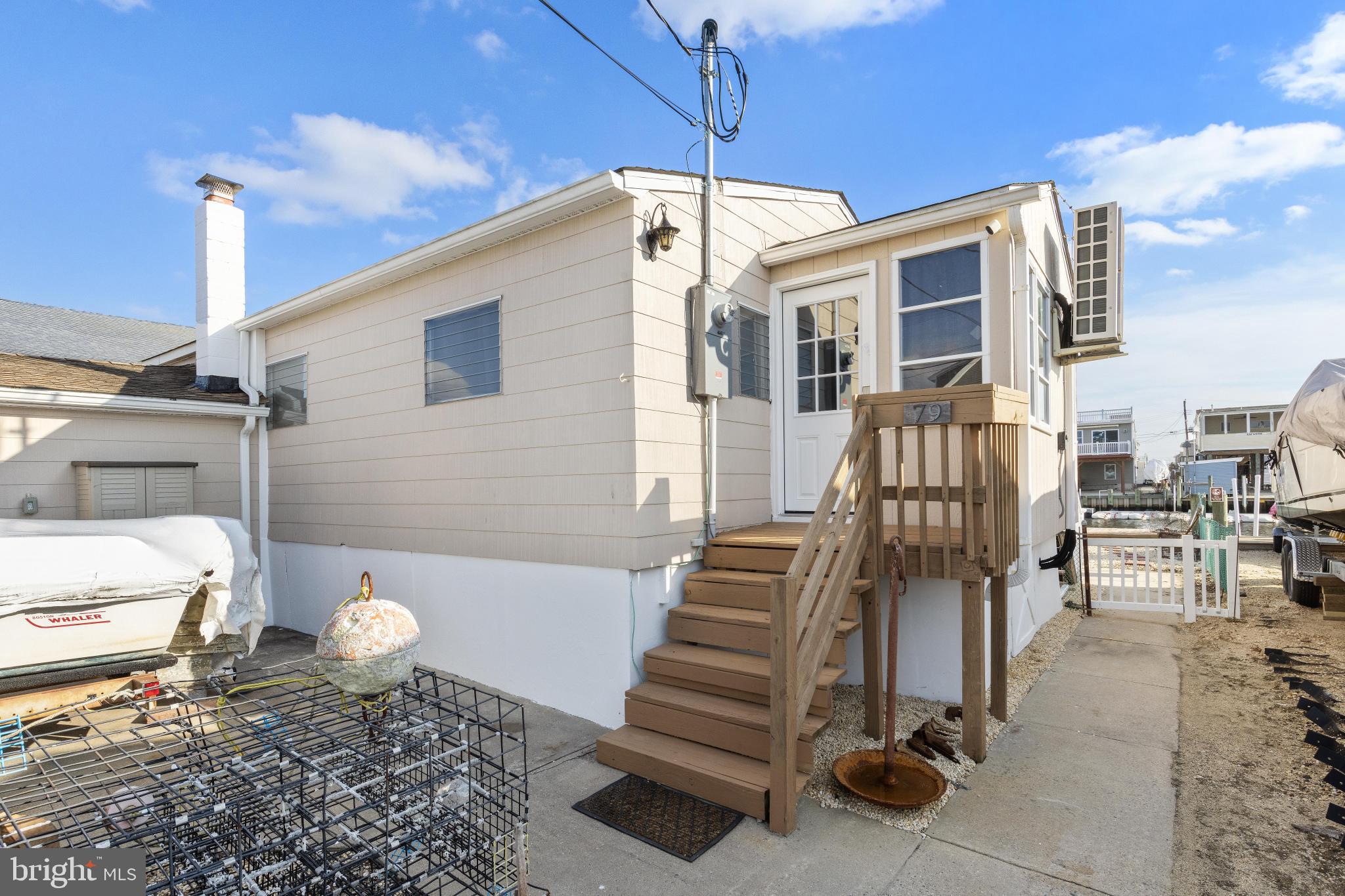 79 Dolphin Road Tuckerton, NJ 08087 - Photo 10 of 53 a front view of a house with a yard