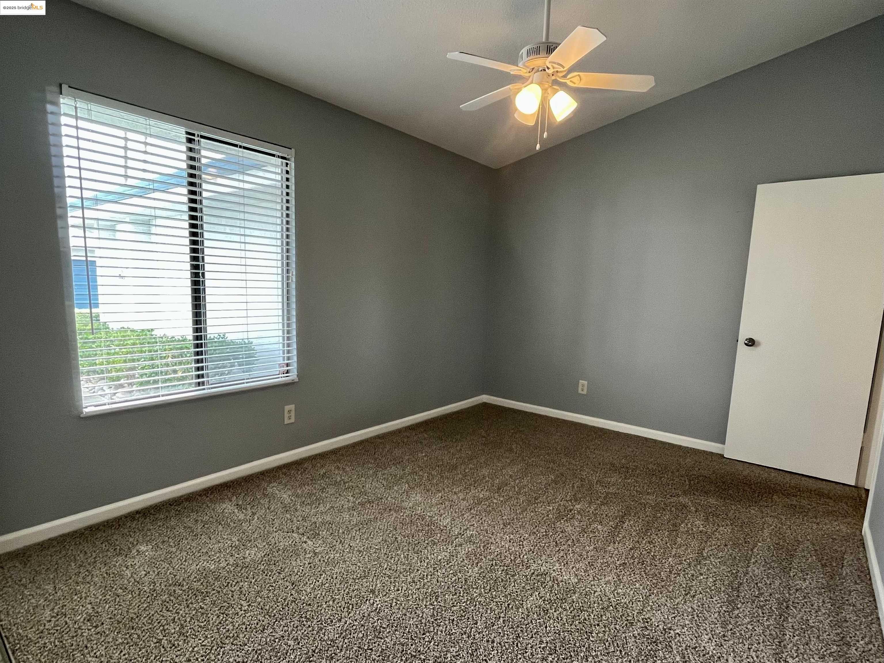 5796 Cutter Loop Discovery Bay, CA 94505 - Photo 12 of 29 a view of an empty room with a window
