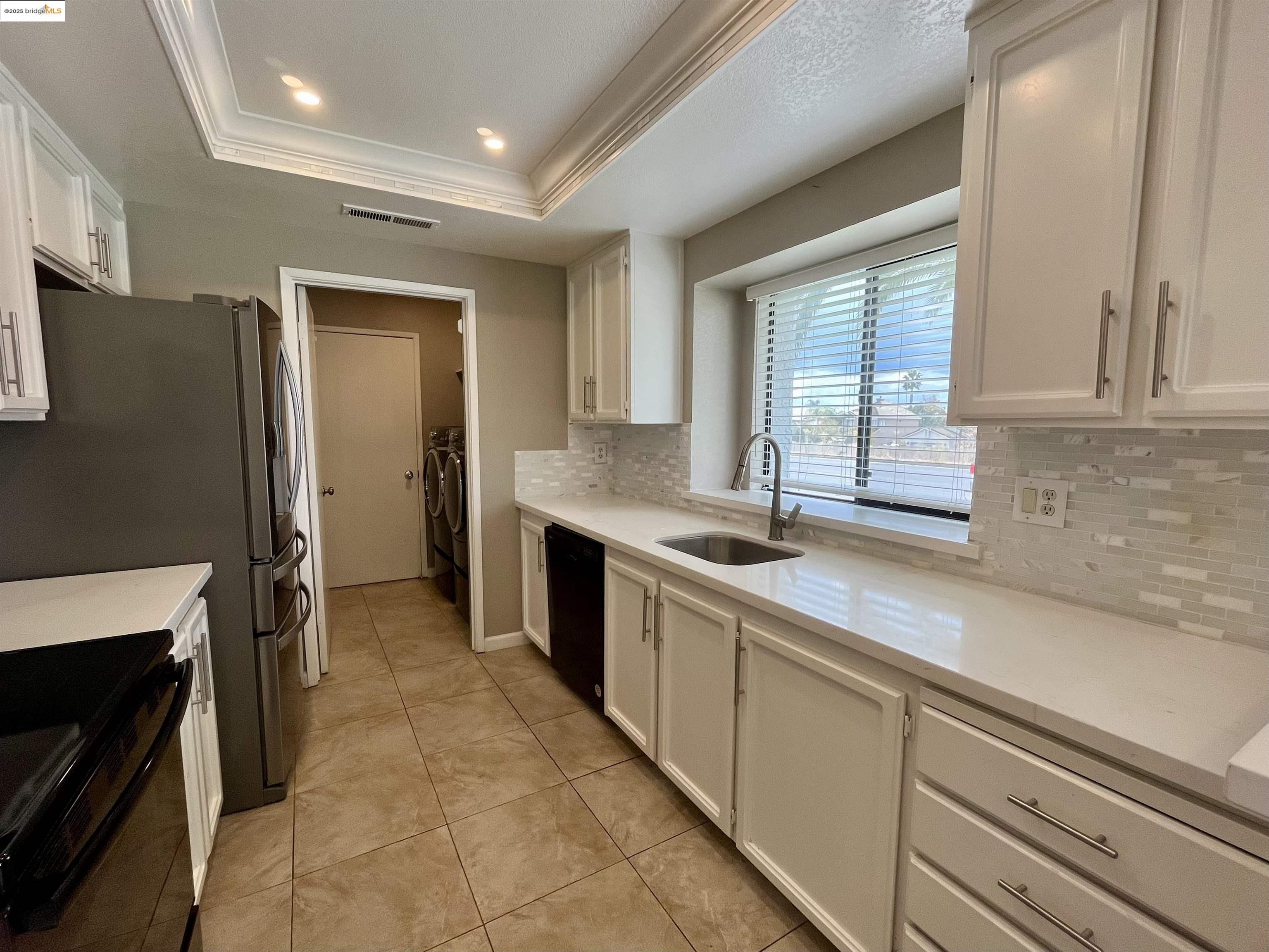 5796 Cutter Loop Discovery Bay, CA 94505 - Photo 19 of 29 a kitchen with stainless steel appliances granite countertop a sink stove and refrigerator