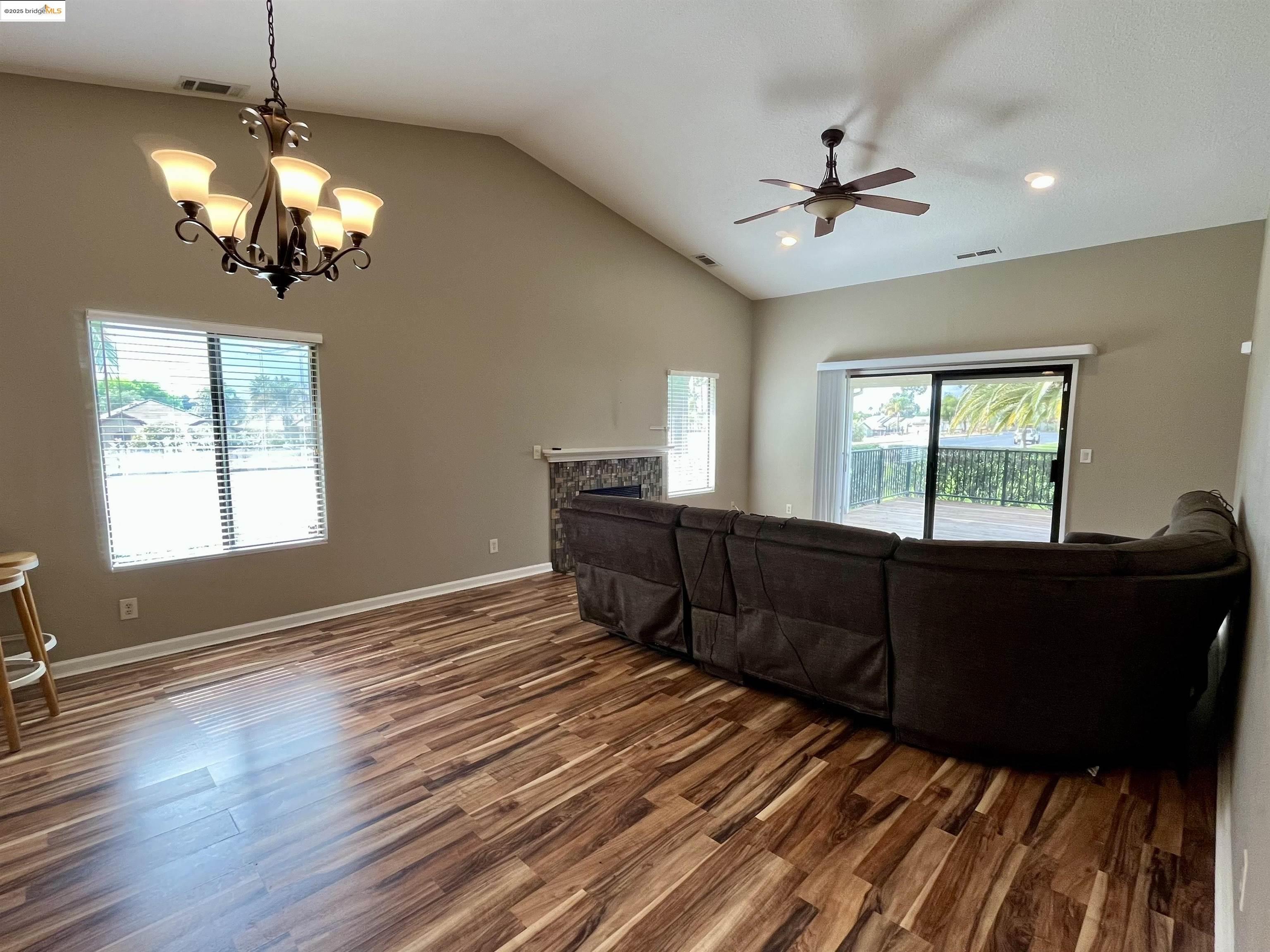 5796 Cutter Loop Discovery Bay, CA 94505 - Photo 5 of 29 a living room with couches and chandelier