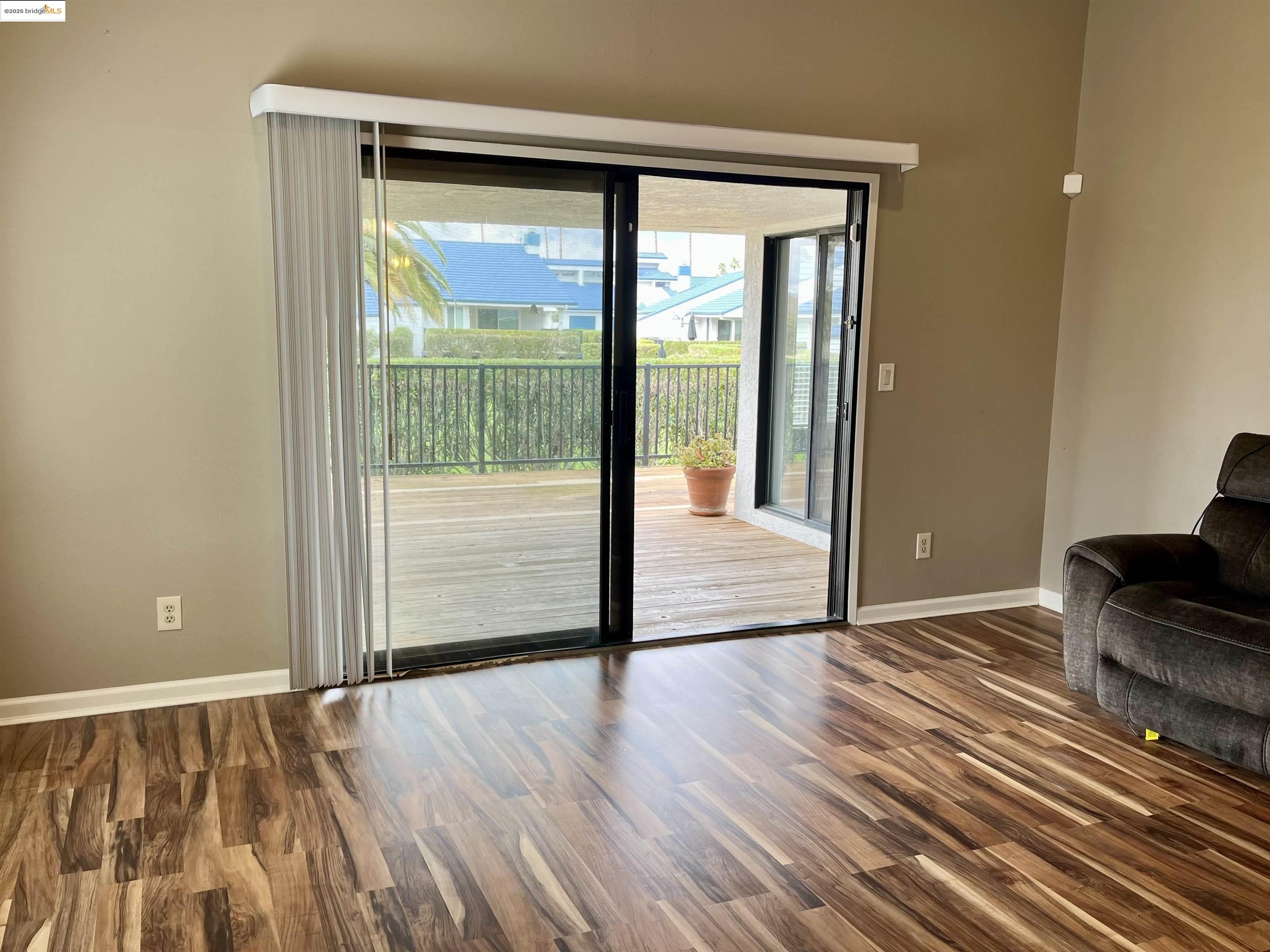 5796 Cutter Loop Discovery Bay, CA 94505 - Photo 7 of 29 a view of an empty room with wooden floor and a window