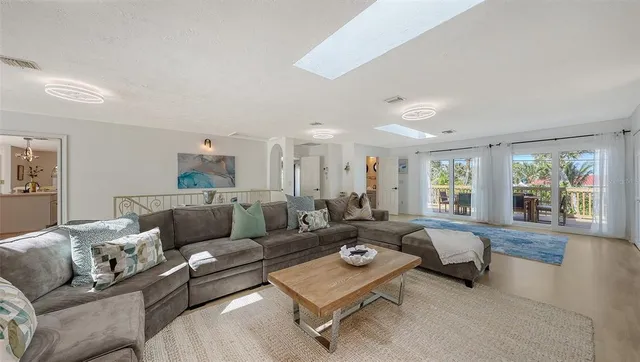 a view of balcony with furniture and umbrella