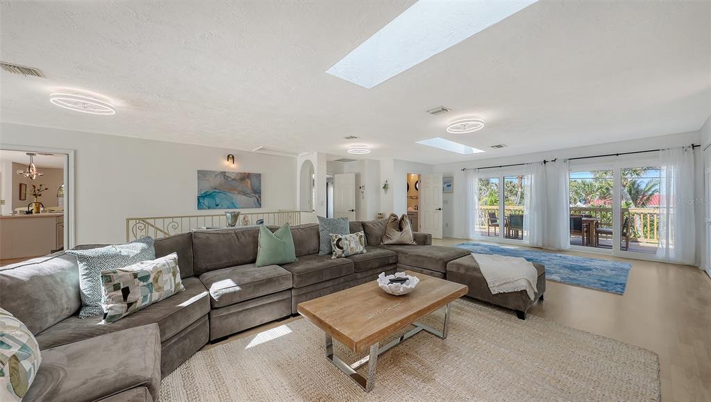 3604 Casey Key Road Nokomis, FL 34275 - Photo 14 of 94 a living room with furniture and a large window
