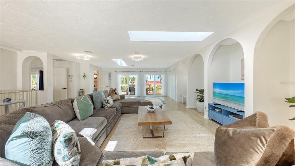 3604 Casey Key Road Nokomis, FL 34275 - Photo 16 of 94 a living room with furniture and a flat screen tv