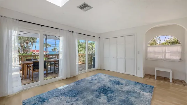 a bedroom with two beds and a table