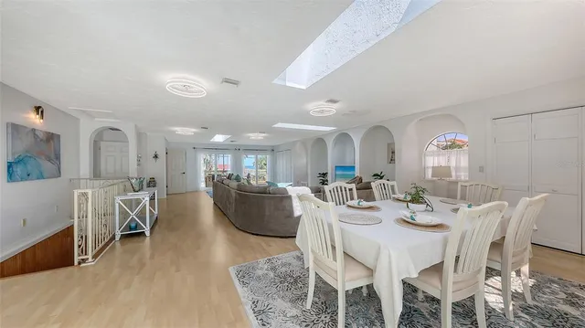 a living room with furniture a rug and a fireplace
