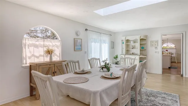 a view of a dining room with furniture and window