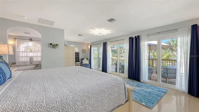 a view of a patio with table and chairs and potted plants