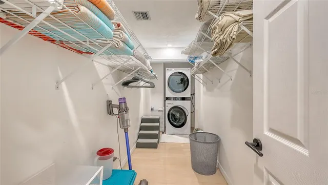 a view of backyard with deck and outdoor seating