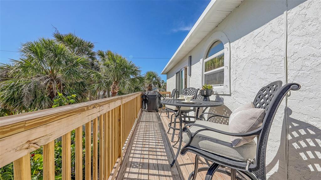 3604 Casey Key Road Nokomis, FL 34275 - Photo 38 of 94 a view of balcony with furniture and wooden deck
