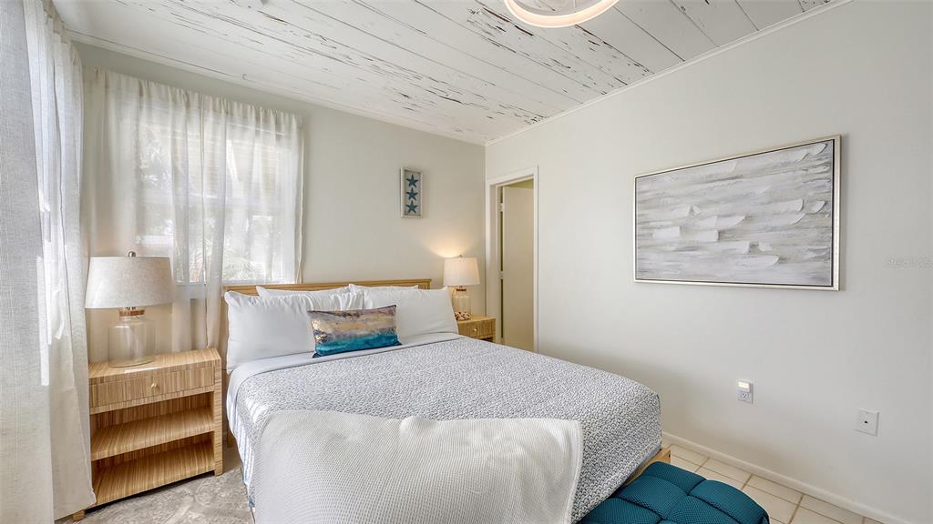 3604 Casey Key Road Nokomis, FL 34275 - Photo 58 of 94 a bedroom with a bed and a window