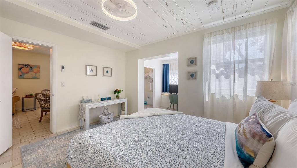 3604 Casey Key Road Nokomis, FL 34275 - Photo 60 of 94 a bedroom with a bed and a couch