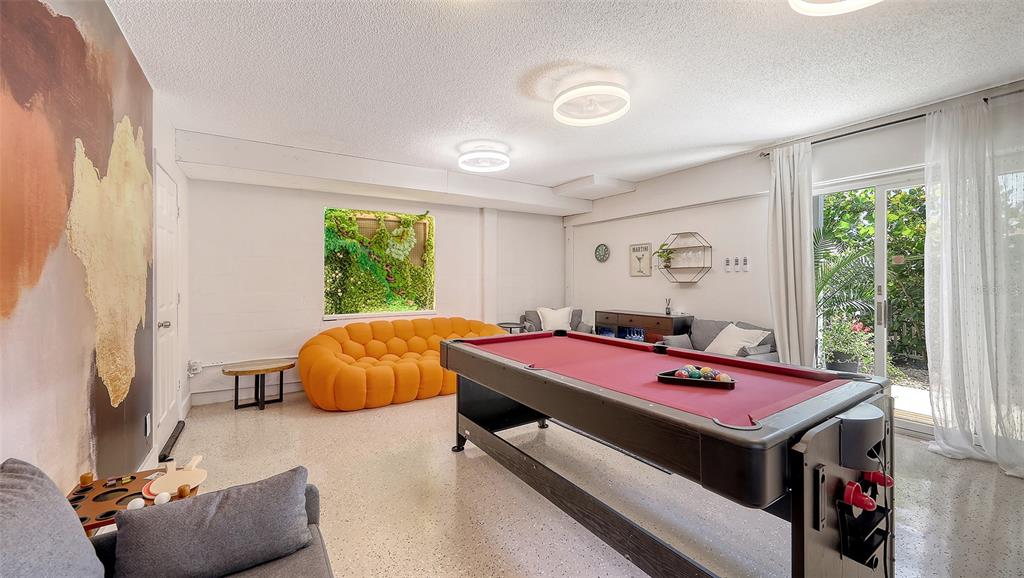 3604 Casey Key Road Nokomis, FL 34275 - Photo 67 of 94 a bedroom with furniture and a large window