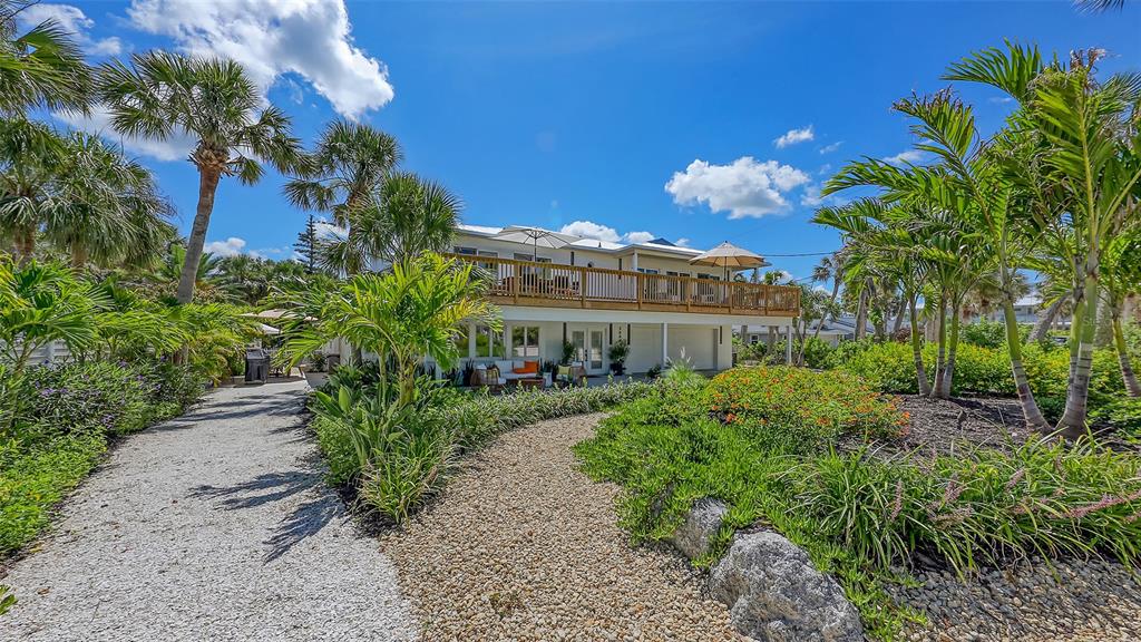 3604 Casey Key Road Nokomis, FL 34275 - Photo 73 of 94 a view of a house with a garden