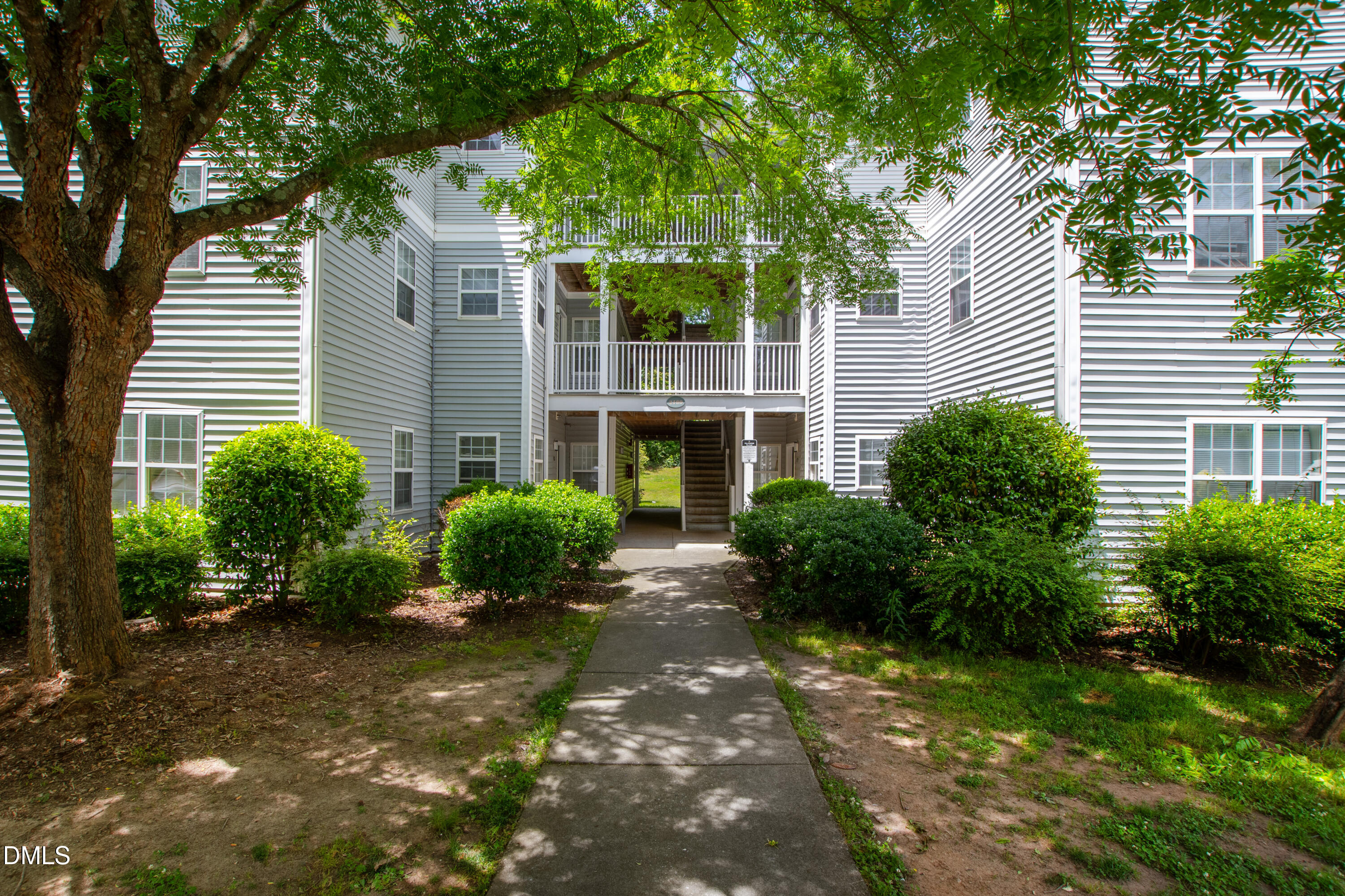 2100 Wolf Tech Lane, Unit 204 Raleigh, NC 27603 - Photo 1 of 40 a front view of a house with garden and plants