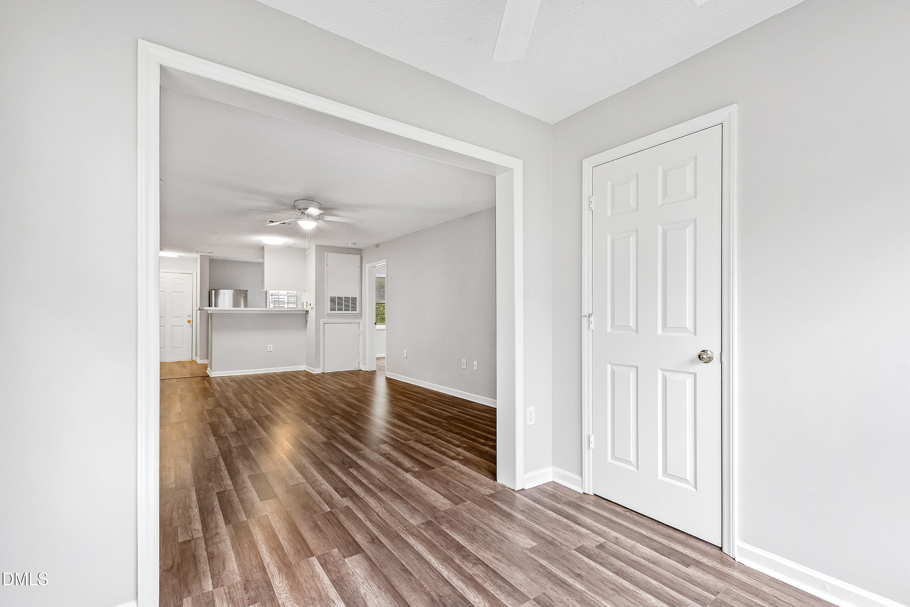 2100 Wolf Tech Lane, Unit 204 Raleigh, NC 27603 - Photo 14 of 40 a view of kitchen and hall with wooden floor