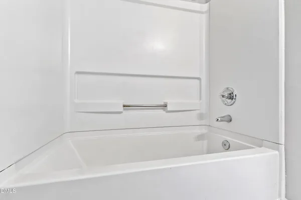 a close view of a bathtub in bathroom