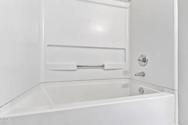 a close view of a bathtub in bathroom