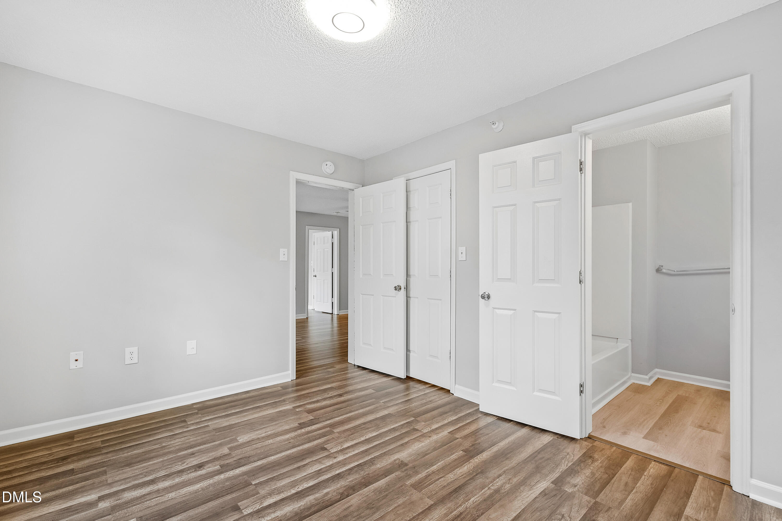 2100 Wolf Tech Lane, Unit 204 Raleigh, NC 27603 - Photo 31 of 40 a view of an empty room and wooden floor