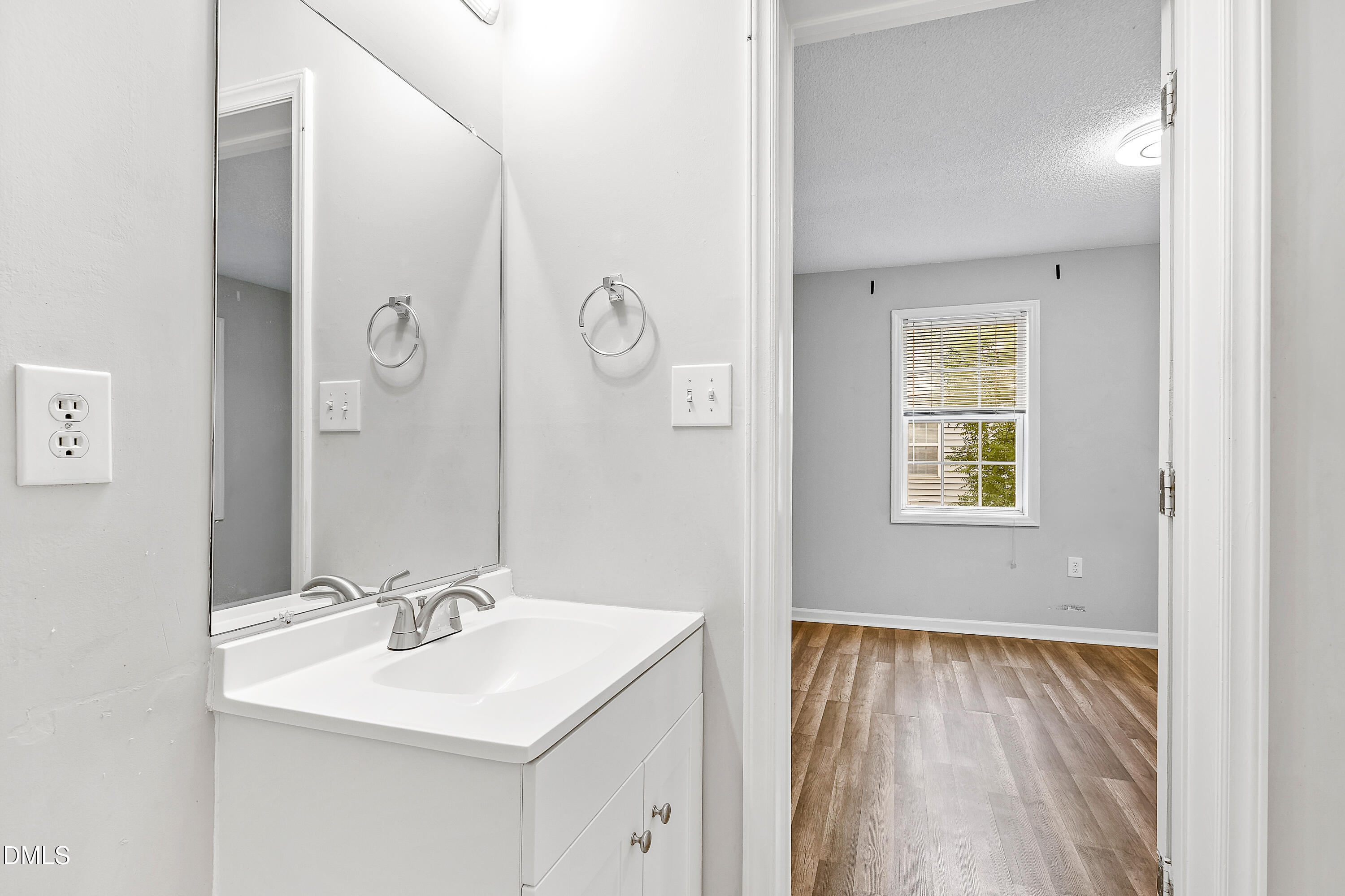 2100 Wolf Tech Lane, Unit 204 Raleigh, NC 27603 - Photo 38 of 40 a bathroom with a sink and a mirror