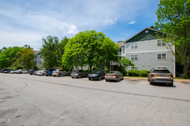 a view of a car parked in front of a house