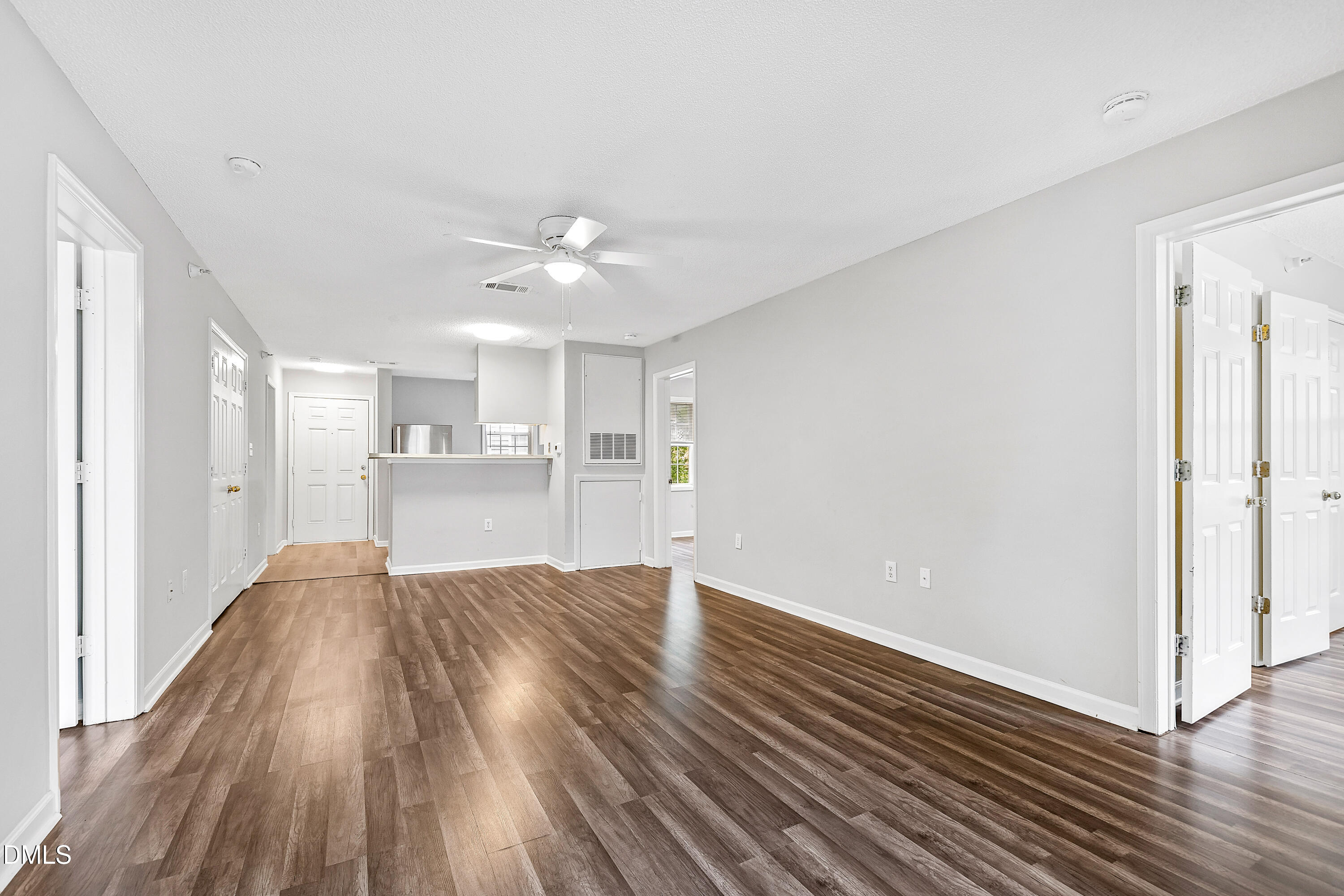 2100 Wolf Tech Lane, Unit 204 Raleigh, NC 27603 - Photo 4 of 40 a view of a kitchen with wooden floor and a kitchen