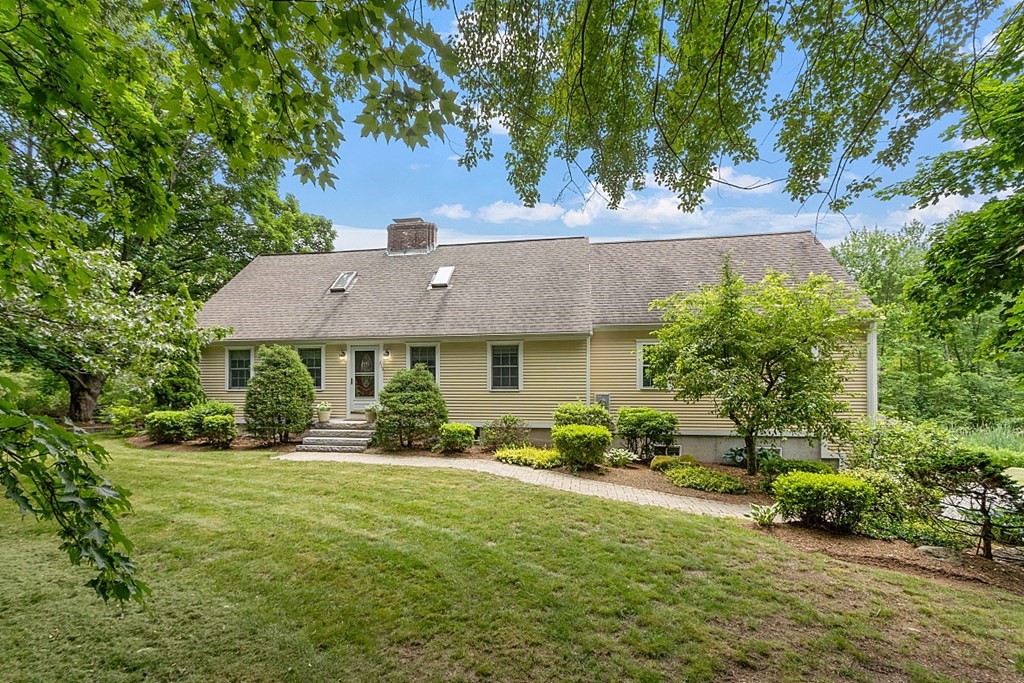 113 Green Road Bolton, MA 01740 - Photo 1 of 41 an aerial view of a house with a yard