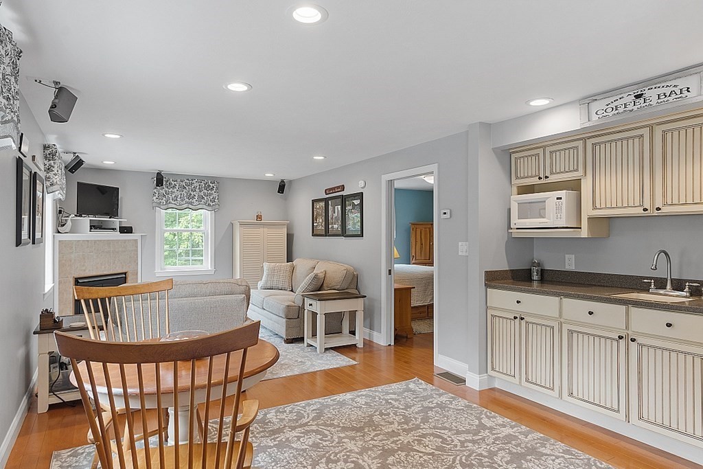 113 Green Road Bolton, MA 01740 - Photo 19 of 41 a living room with furniture and a wooden floor
