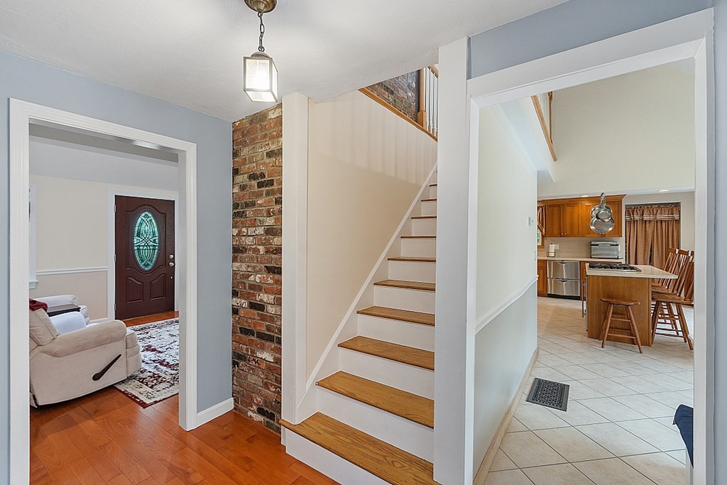 113 Green Road Bolton, MA 01740 - Photo 25 of 41 a view of entryway and hall with wooden floor