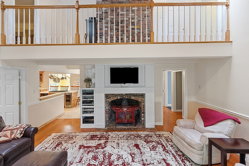 113 Green Road Bolton, MA 01740 - Photo 3 of 41 a living room with furniture and a fireplace