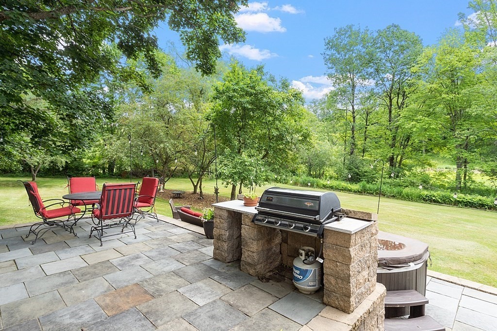 113 Green Road Bolton, MA 01740 - Photo 32 of 41 a view of a backyard with sitting area
