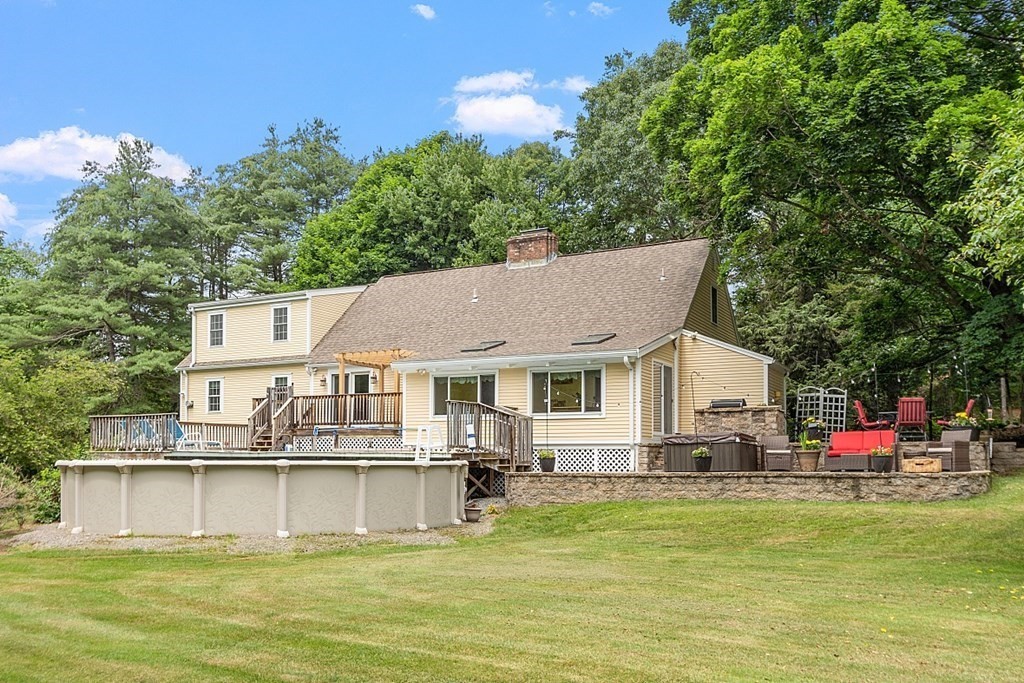 113 Green Road Bolton, MA 01740 - Photo 34 of 41 a view of a house with a swimming pool