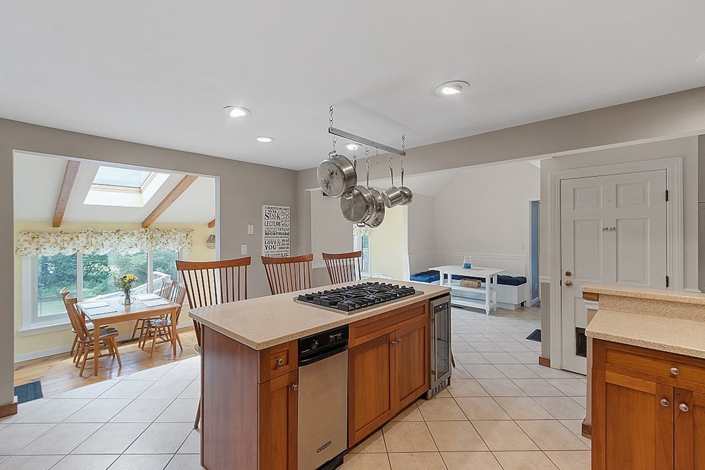 113 Green Road Bolton, MA 01740 - Photo 8 of 41 a kitchen that has a stove and a table in it