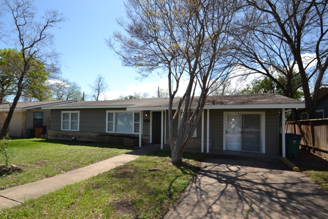 1211 Ridgemont Drive Austin, TX 78723 - Photo 28 of 28 a view of a house with a yard