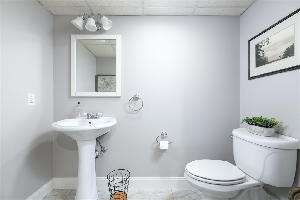 27 Vista Circle Rutland, MA 01543 - Photo 26 of 35 a bathroom with a toilet sink and mirror