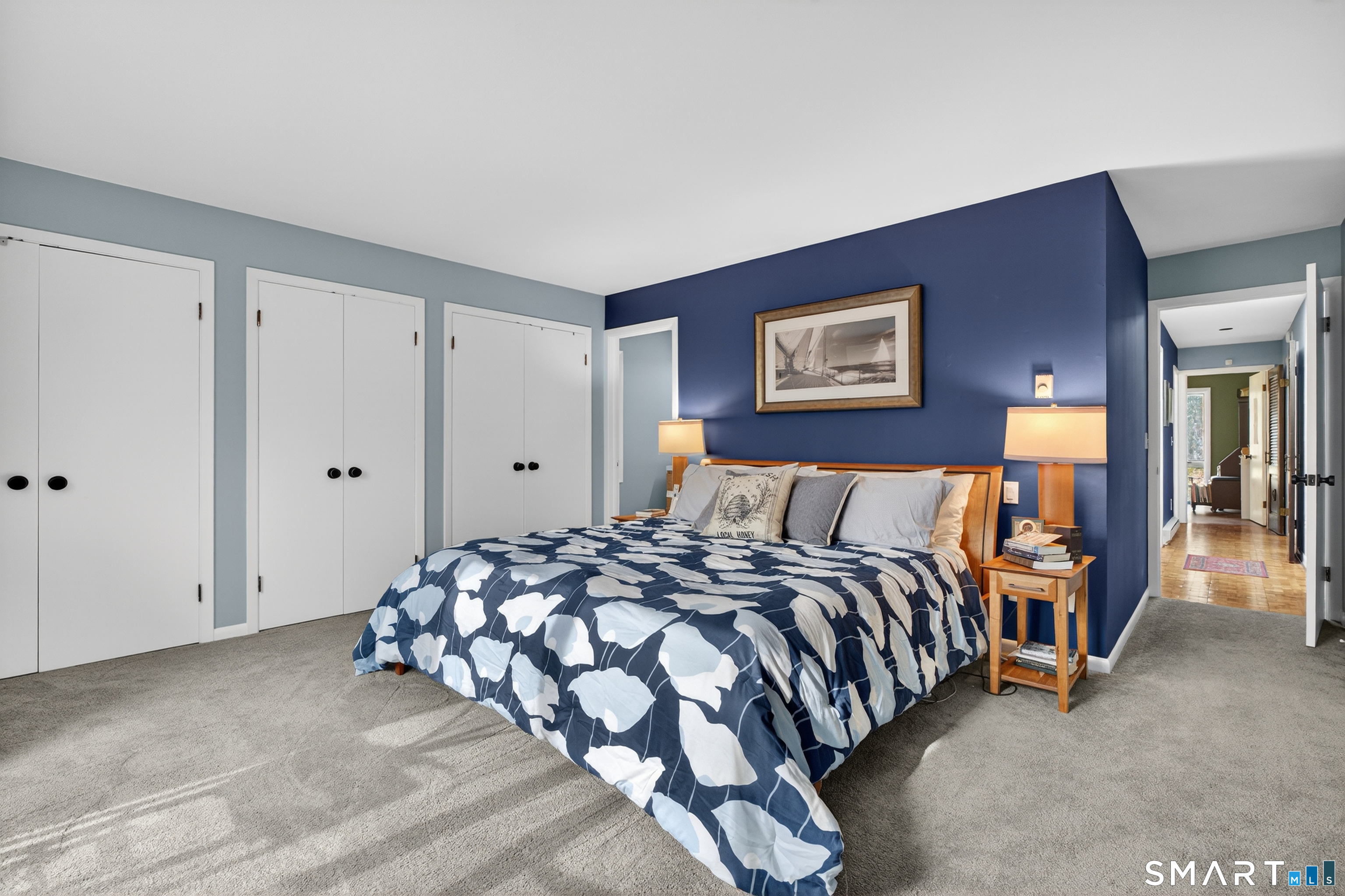 230 Six Rod Highway Hamden, CT 06518 - Photo 17 of 38 a bedroom with a bed and a painting on the wall