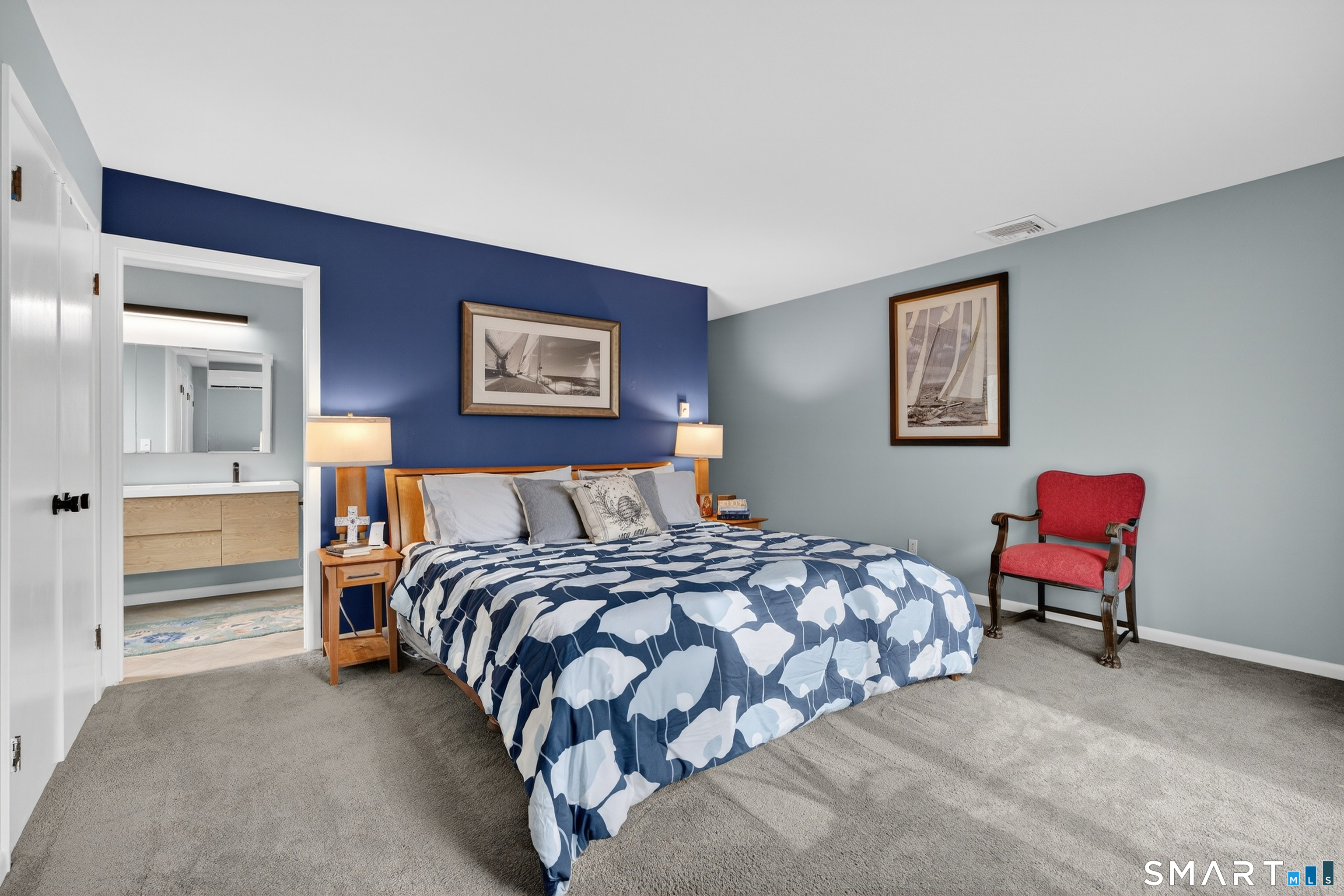 230 Six Rod Highway Hamden, CT 06518 - Photo 18 of 38 a bedroom with a bed and a lamp on table