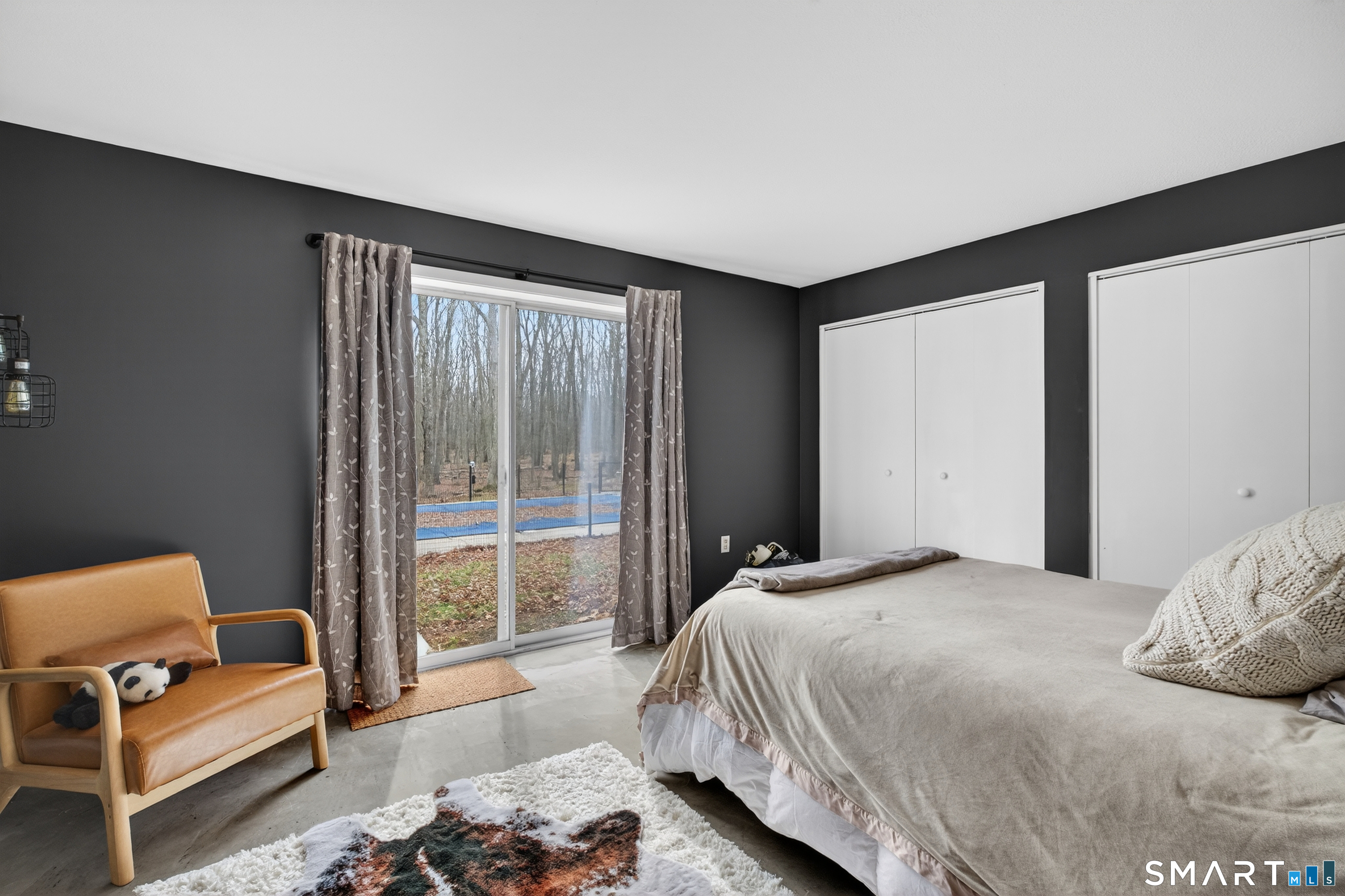 230 Six Rod Highway Hamden, CT 06518 - Photo 24 of 38 a bedroom with a bed and a couch