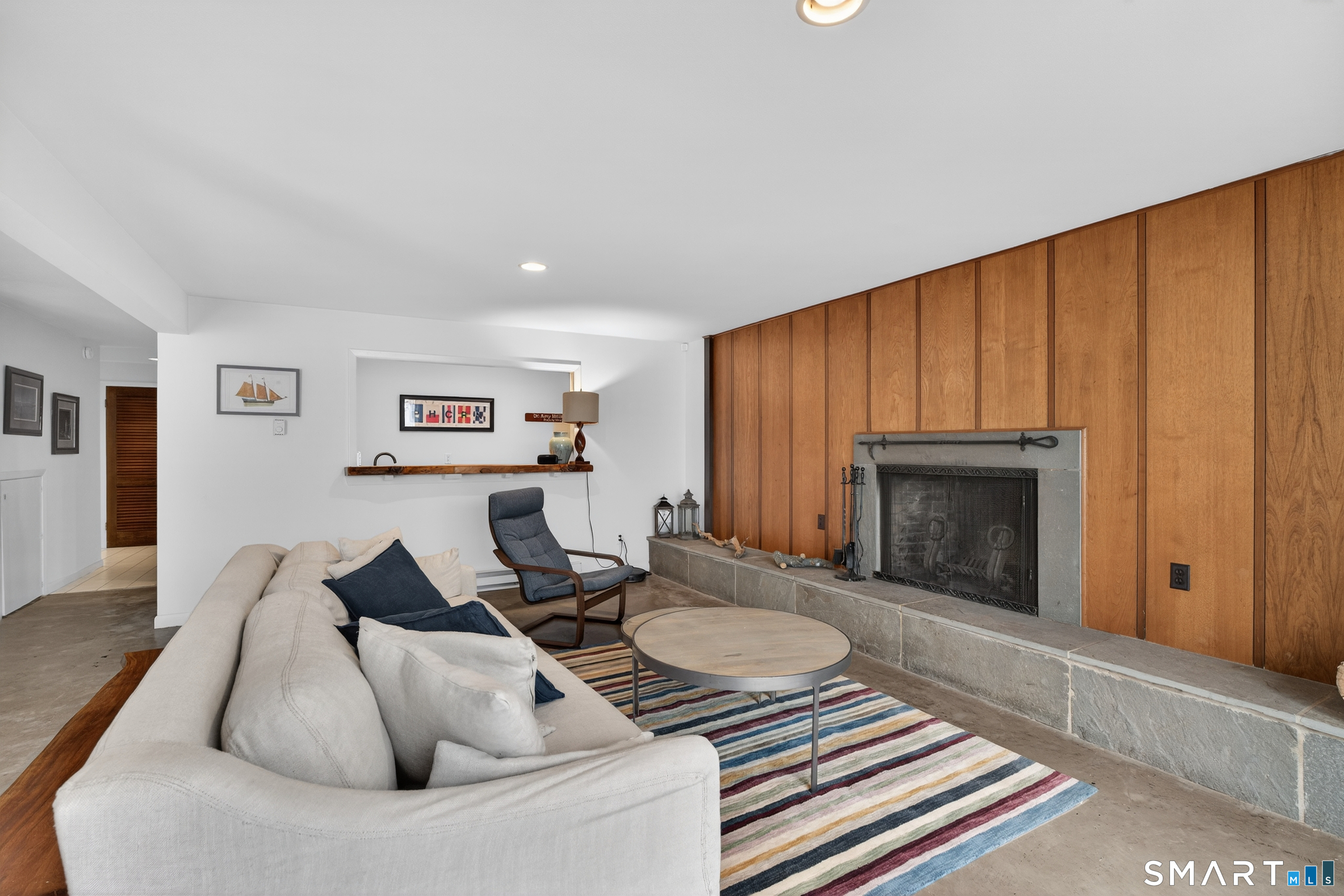 230 Six Rod Highway Hamden, CT 06518 - Photo 27 of 38 a living room with furniture and a fireplace