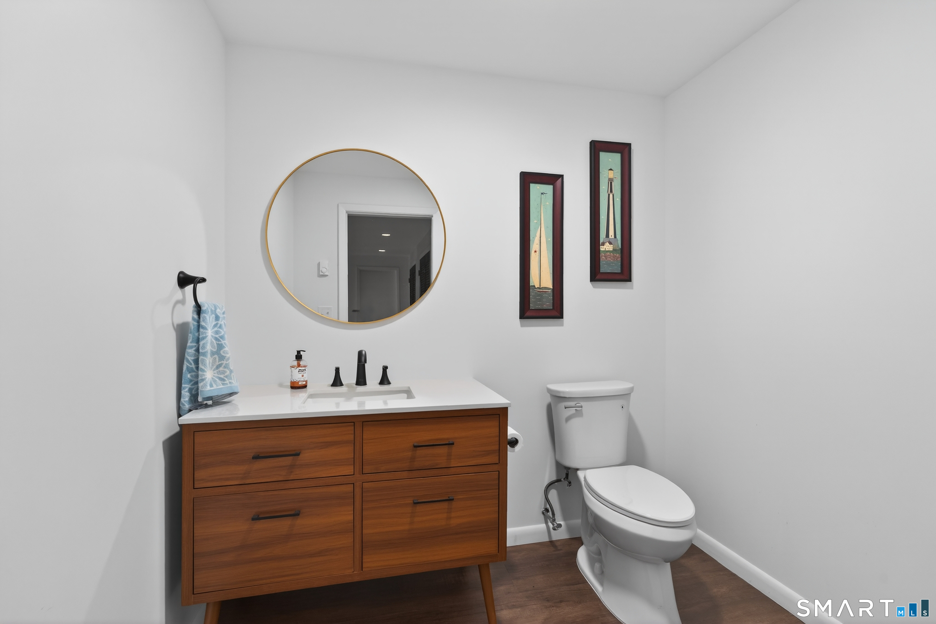 230 Six Rod Highway Hamden, CT 06518 - Photo 28 of 38 a bathroom with a toilet a sink and mirror
