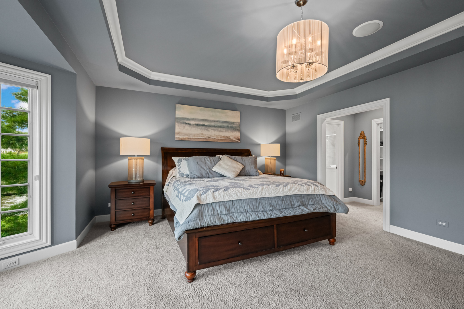 35 Riderwood Road North Barrington, IL 60010 - Photo 19 of 59 a bedroom with a bed and a chandelier